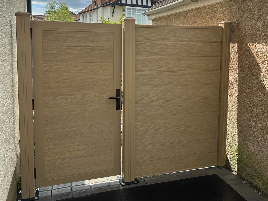 Newly installed fence panels along a garden boundary in South Wales