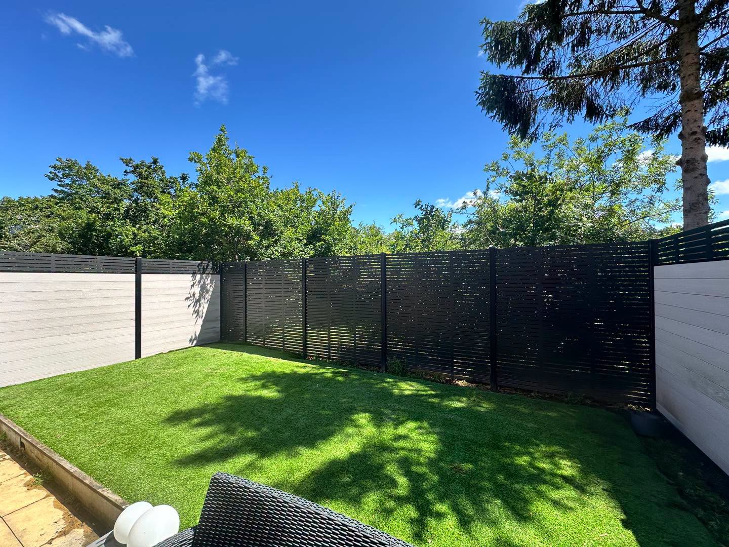 Metal fencing run completed along a residential property line
