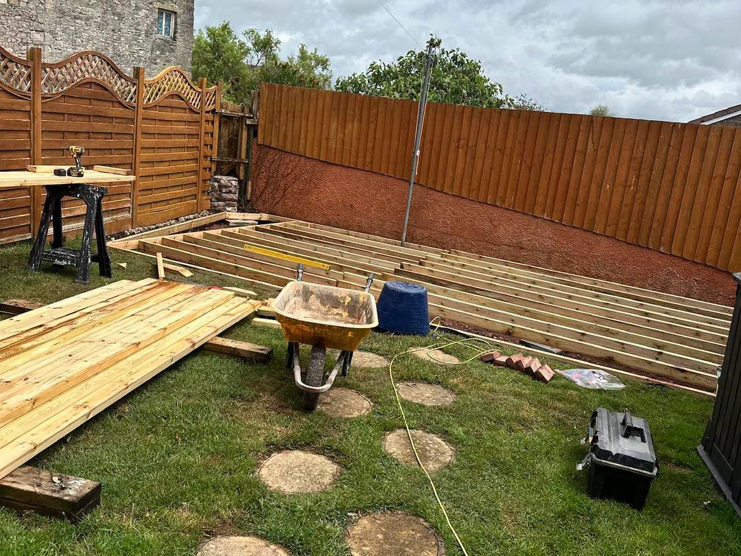 Sandstone patio and fencing combined in a finished garden