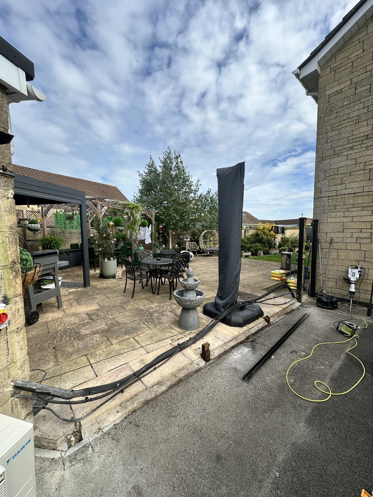 Before: an open frontage with no gate or boundary fence