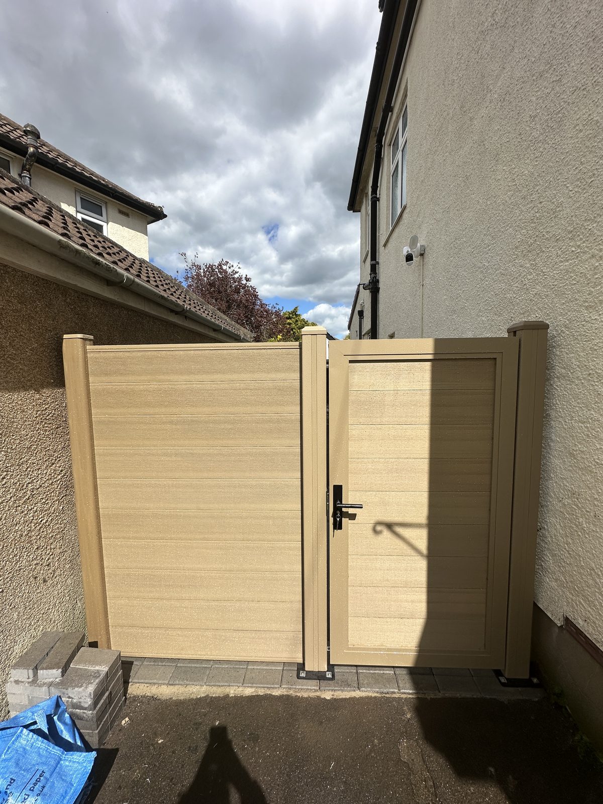 Oak-effect composite gate and matching composite fence panel
