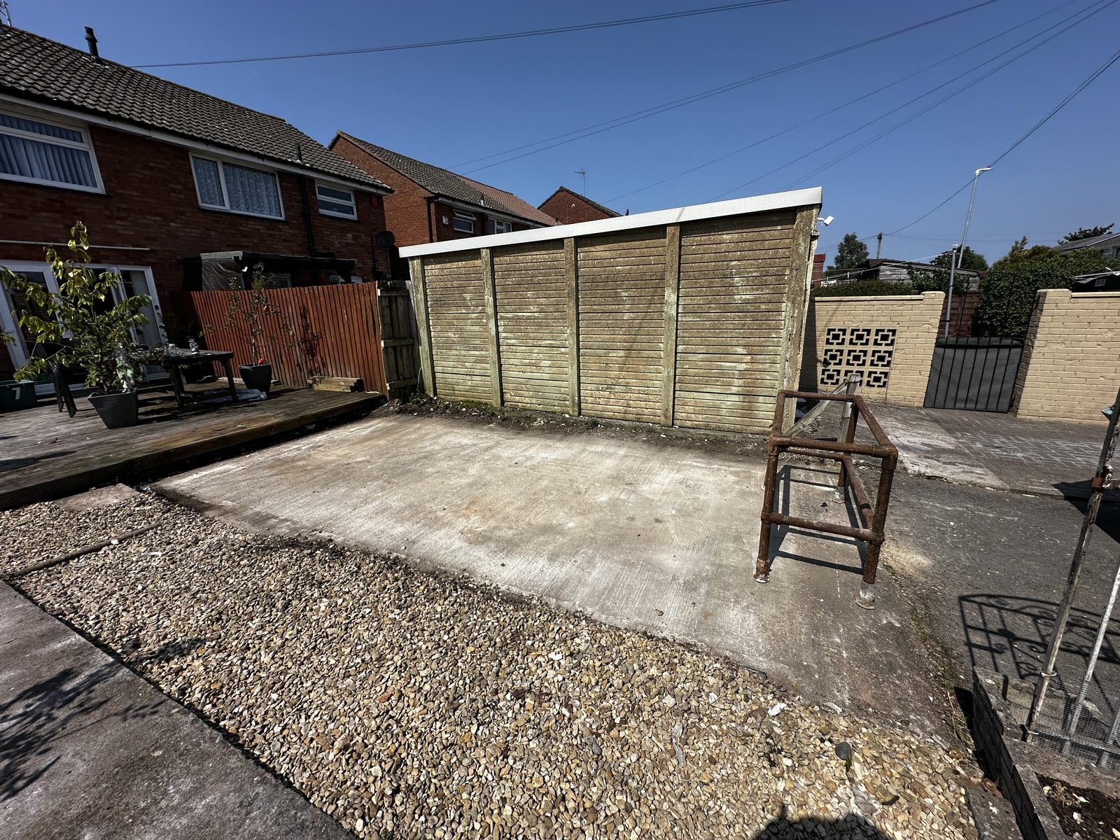 Garden cleared to a tidy slab after a garage demolition