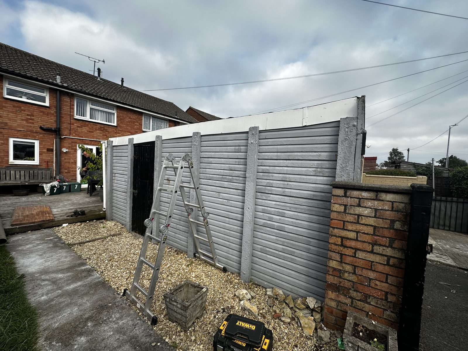 An old garage being taken down, ready for demolition and clearance