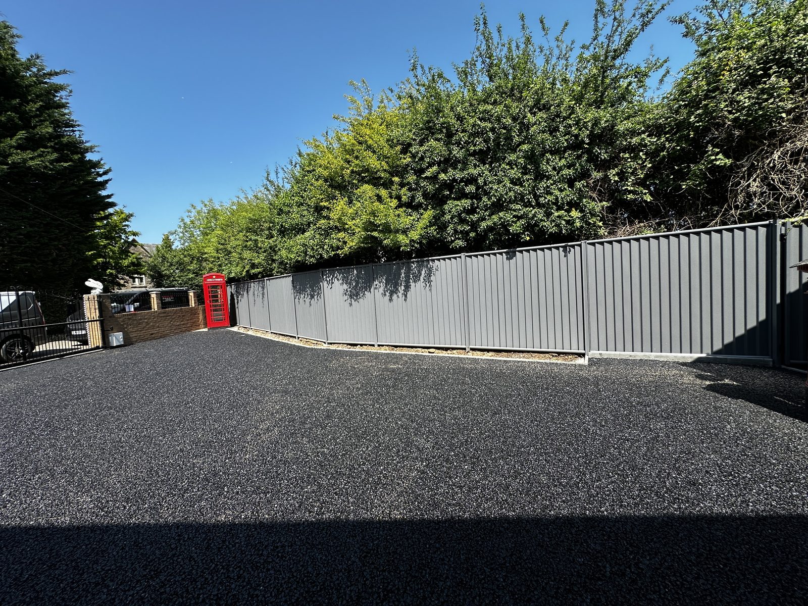 After: a new driveway and tidy, fenced frontage