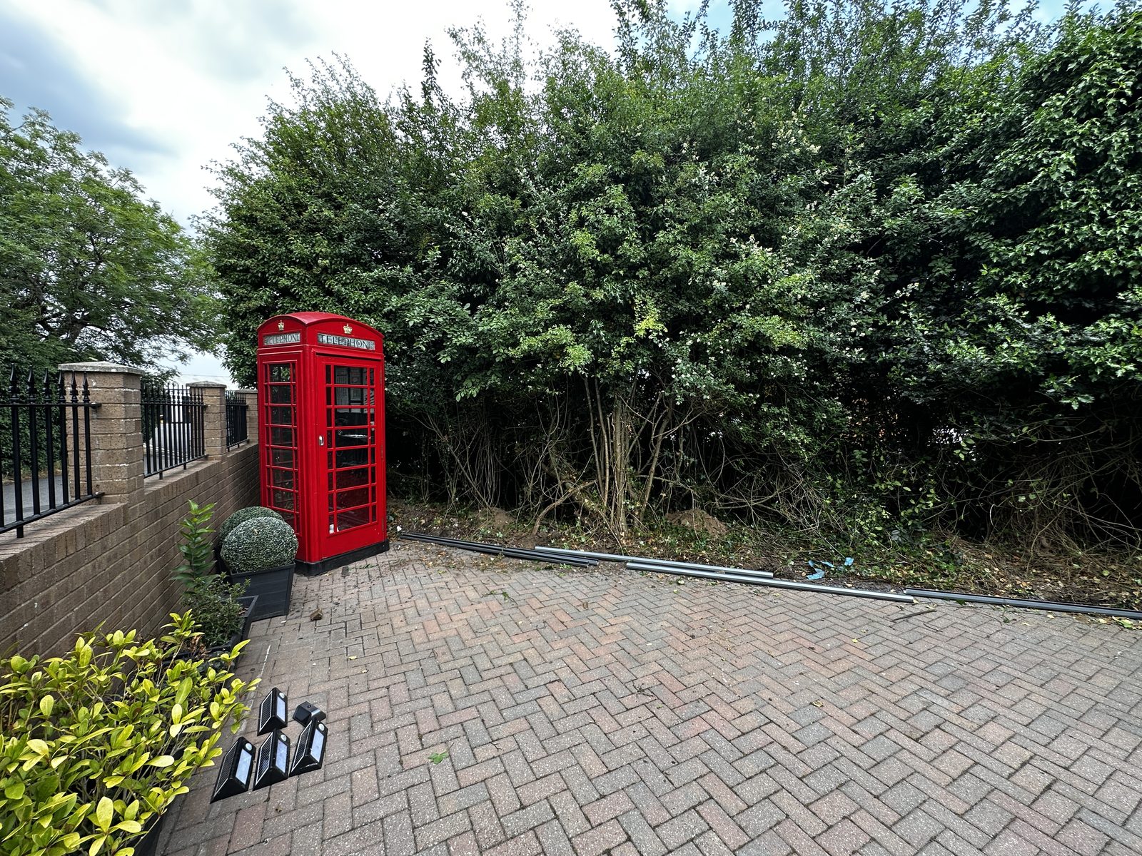 Before: a worn driveway and frontage