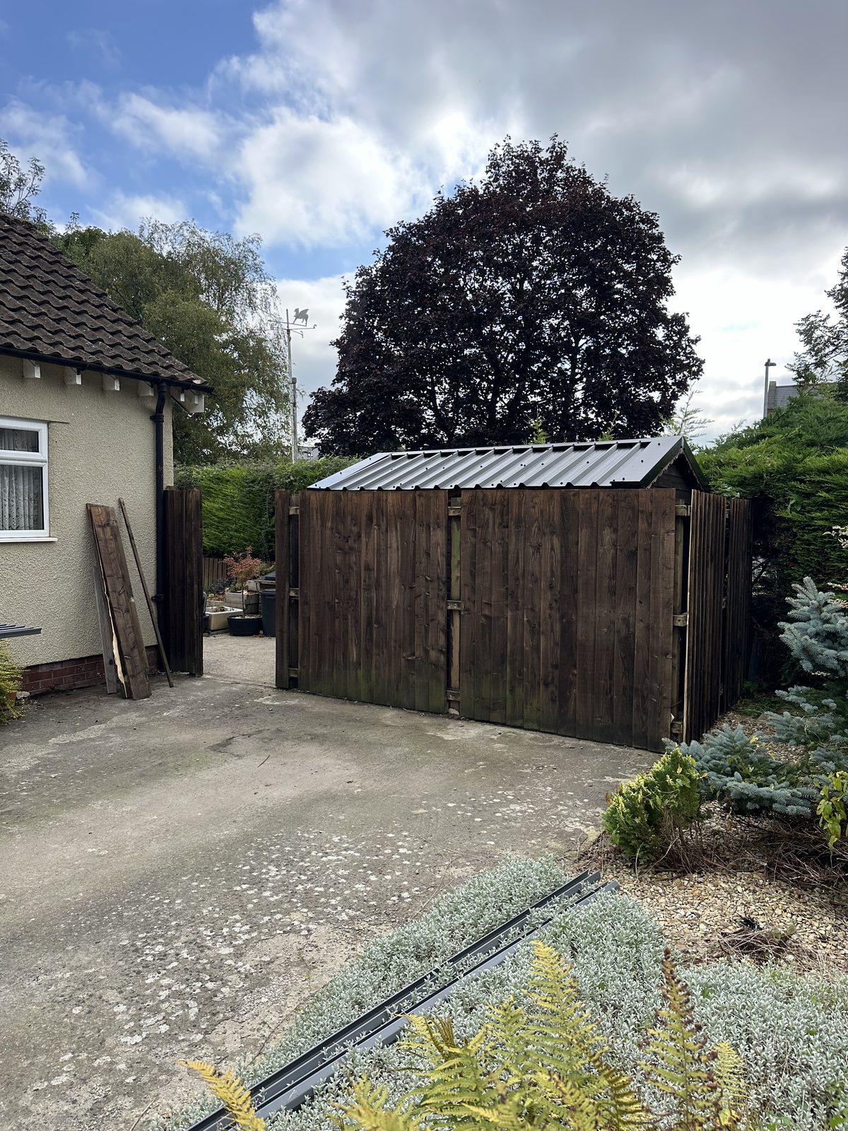 Before: an open driveway with no gate