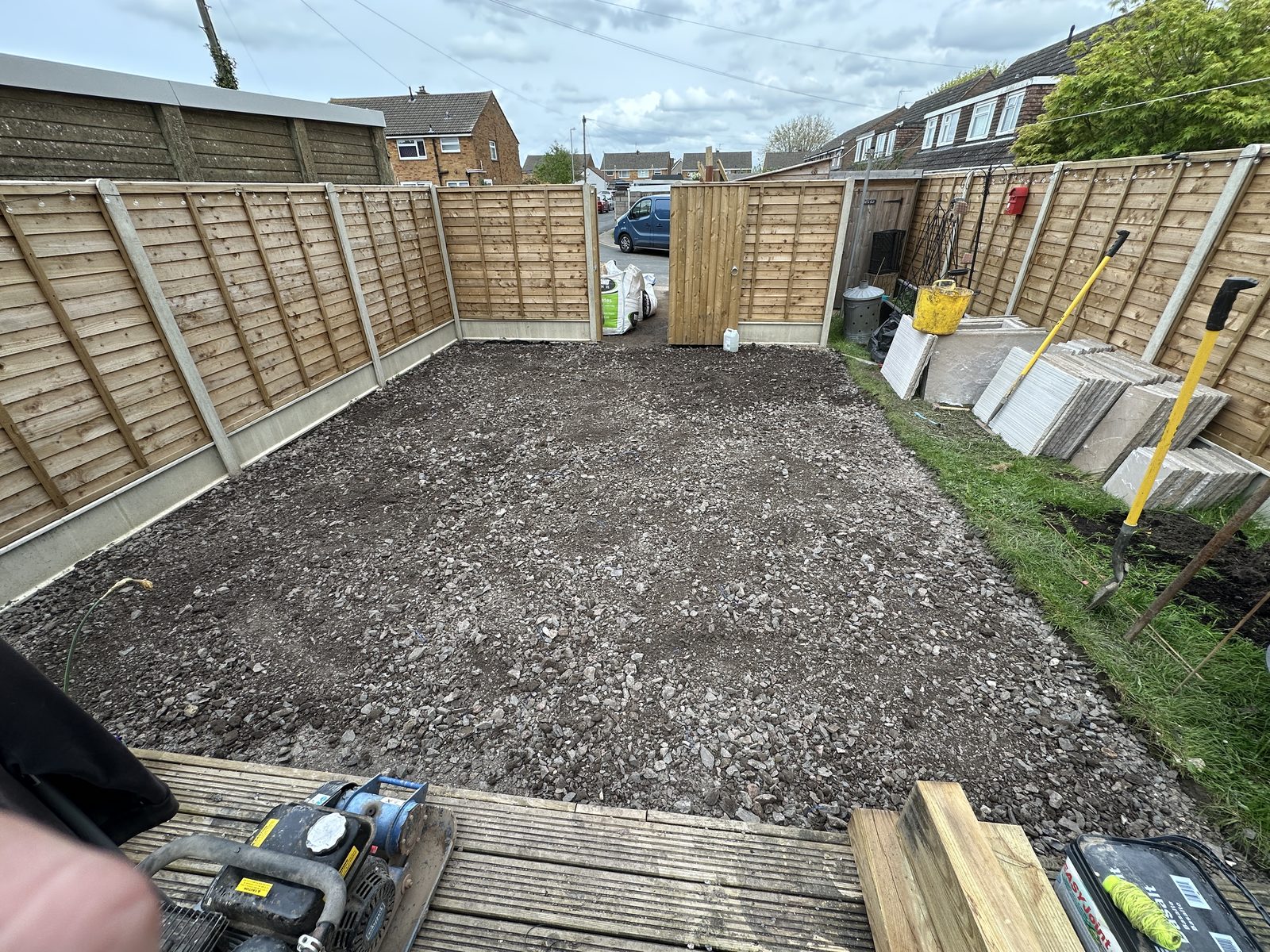 Before: a dug-out garden on a prepared sub-base, ready for paving