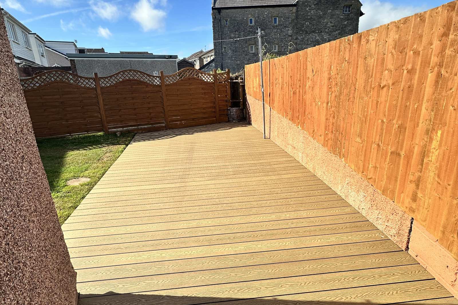 Teak composite decking viewed along its length.