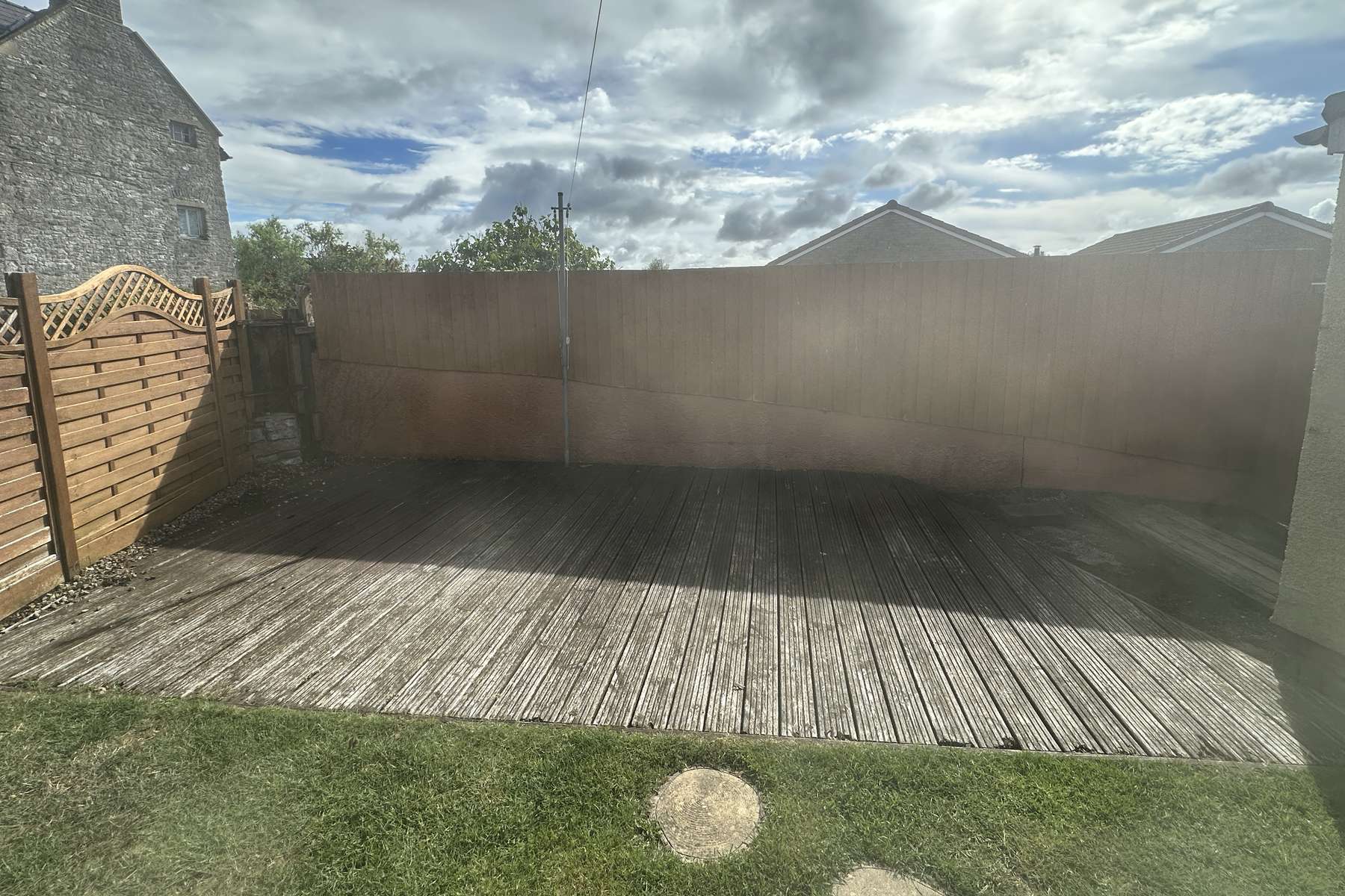 Tired timber decking before replacement.